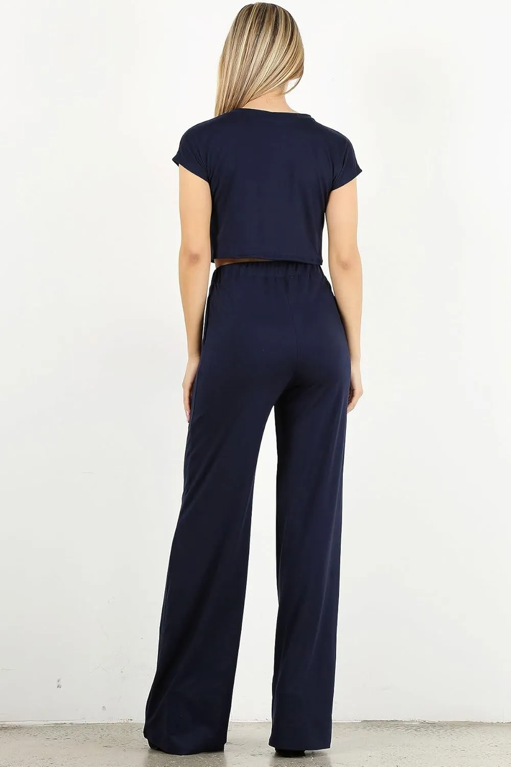Minimal 2 PC Set: Short Sleeve Crop top paired with high Waisted Wide Leg Trousers with an Elastic Waistband.